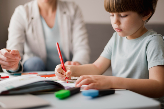 Child working with tutor picture